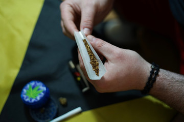 
Male hands hold the joint