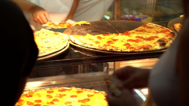 Selling delicious hot pizzas outside in the evening. Street Food, Fast Food Trade, Background, slow motion, nighttime