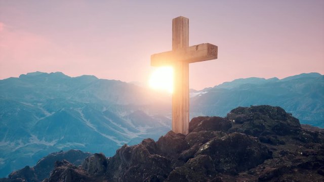 Cross on the mountain of Christian faith with sunrise of faith of Chris 
