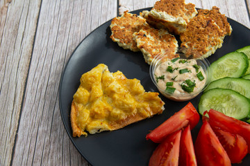 Chicken fritters with vegetables and eggs with cauliflower and sauce