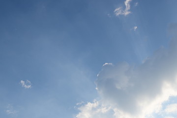 fluffy cloud above blue sky with sunlight in the morning