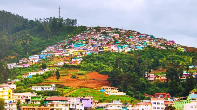 Ooty, India time-lapse during cloudy day. Aerial view of Nilgiri mountain village in Tamil Nadu, India. Ooty is a popular resort with beautiful nature, zoom in