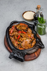 Beef with vegetables on a tray in the form of a cow