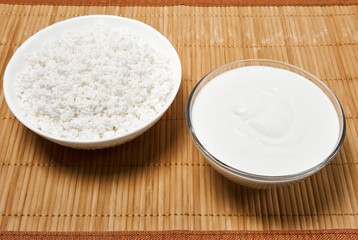 bowls with cottage cheese and sour cream on the table