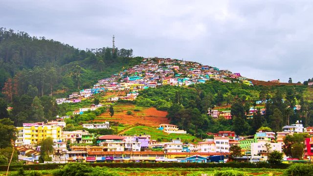 Ooty, India time-lapse during cloudy day. Aerial view of Nilgiri mountain village in Tamil Nadu, India. Ooty is a popular resort with beautiful nature