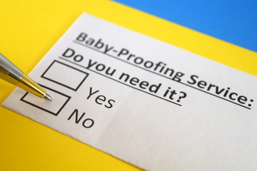Obraz premium One person is answering question about baby proofing service.