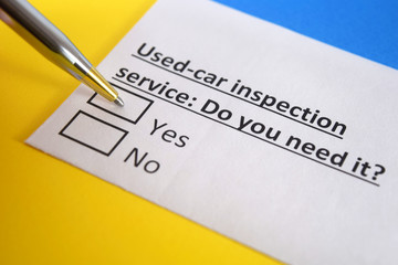 Obraz premium One person is answering question about used car inspection service.