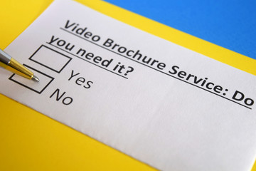 Fototapeta premium One person is answering question about video brochure service.