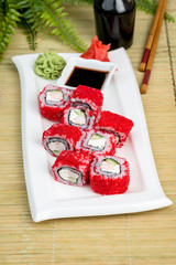 California sushi on a white plate with sauce