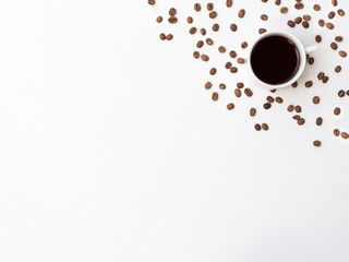 Coffee beans and coffee mug on white background. Coffee background