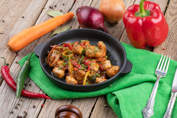 chicken briskaet fried on pan with vegetables