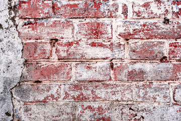 Texture of a brick wall with cracks and scratches which can be used as a background