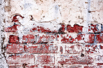 Texture of a brick wall with cracks and scratches which can be used as a background