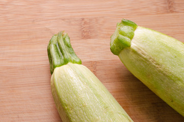 zucchini on a wooden background, fresh vegetables for food