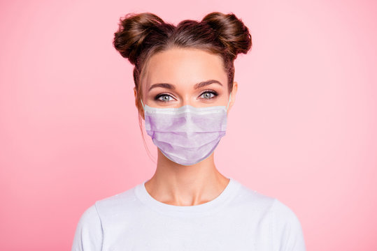 Close-up portrait of her she nice attractive lovable cute adorable winsome girl with two buns wear white shirt protection flu cold facial mask isolated over pink pastel background