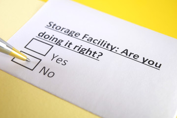 Obraz premium One person is answering question about storage facility.