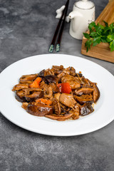 Chinese shiitake mushrooms stewed with meat in a white plate