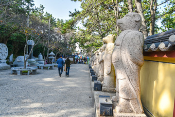 Busan city, South Korea - NOV 01, 2019: Stone statues of chinese horoscope in Haedong Yonggung Temple.

