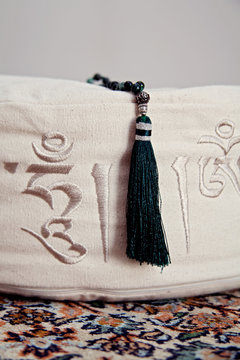 Mala on meditation cushion