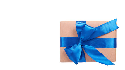 Gift box wrapped with brown paper. Isolated.
