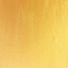 Gold paint on cement wall texture