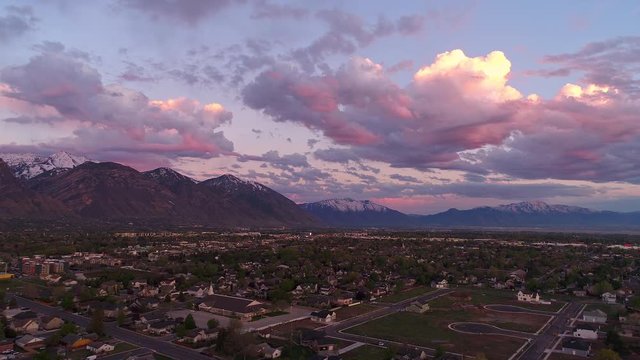 Aerial hyperlapse during colorful sunset in Utah Valley.