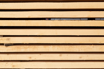 Obraz premium Edged boards in stock, ready for sale. Warehouse of construction materials.