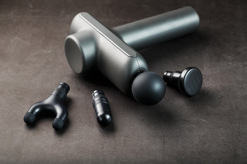 Machine for body massage on a black background.
