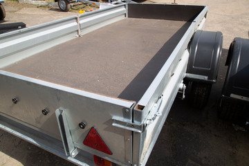 Open car trailer. Trailer for passenger cars.Sale, rental and maintenance of trailers.