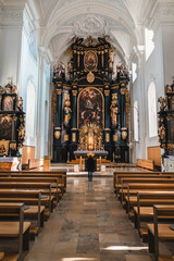 Fototapeta na wymiar Bright German church with person