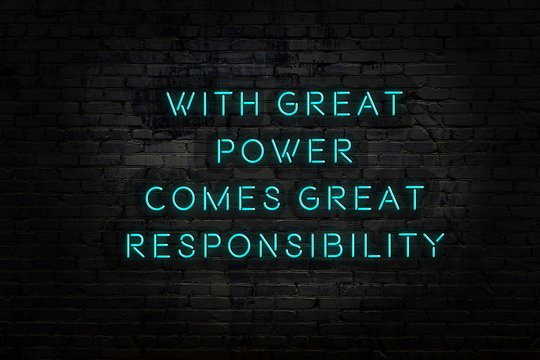 Wise quote. Neon inscription against brick wall