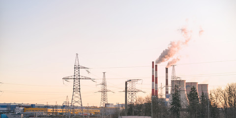 powerful heating station with high chimneys and power transmission line towers