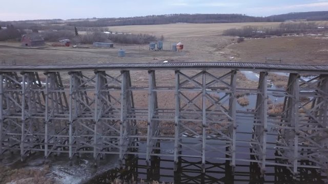 Aerial dolly: decommissioned rickety old prairie railway trestle