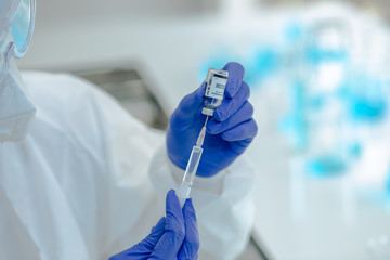 Close-up on Laboratory Tube Virus corona covid 19 vaccine. Scientist research for new novel corona...