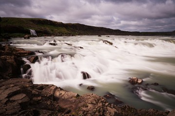 Waterfall with cloudy skies in Iceland