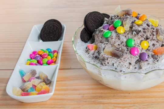 Chocolate patbingsu brownies or shaved ice on the table, wooden background.