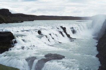 Waterfall with cloudy skies in Iceland
