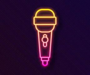 Glowing neon line Microphone icon isolated on black background. On air radio mic microphone. Speaker sign. Vector Illustration