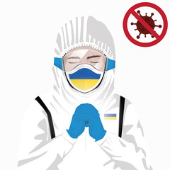 Covid-19 or Coronavirus concept. Ukrainian medical staff wearing mask in protective clothing and praying for against Covid-19 virus outbreak in Ukraine. Ukrainian man and Ukraine flag. Pandemic virus