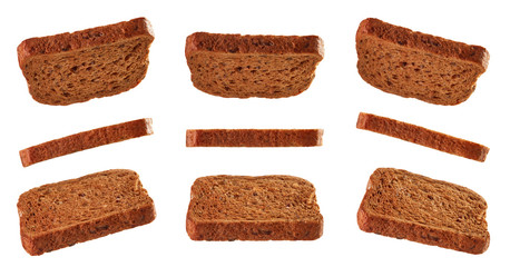 Slices of toasted bread flying isolated on white