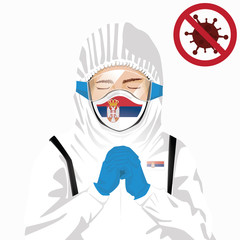 Covid-19 or Coronavirus concept. Serbian medical staff wearing mask in protective clothing and praying for against Covid-19 virus outbreak in Serbia. Serbian man and Serbia flag. Pandemic corona virus