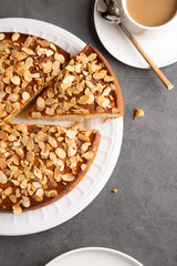 Traditional sponge almond cake with a cup of coffee