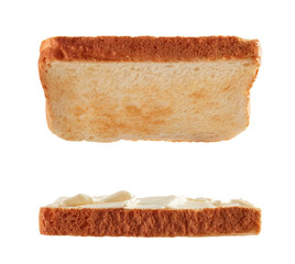 Slices of toasted bread with cream cheese flying isolated on white