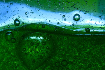 Bubbles on green background horizontal seamless pattern. Circle and liquid, light design, clear soapy shiny.