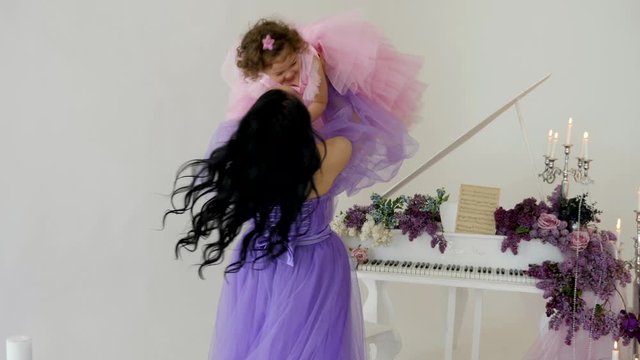 Mother playing with her little girl