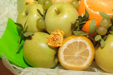 Fruit and floral green bouquet with apples and citrus