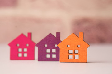 colorful wooden houses on white , the concept of finance concept