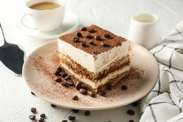 Composition with plate of tasty tiramisu on white background. Delicious dessert