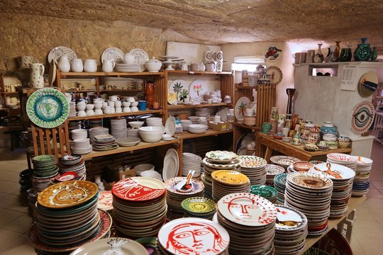 GROTTAGLIE, ITALY - JUNE 3, 2017: A traditional ceramics handicraft shop in Grottaglie, Italy. Grottaglie is a famous handmade ceramics production town in the region of Apulia.