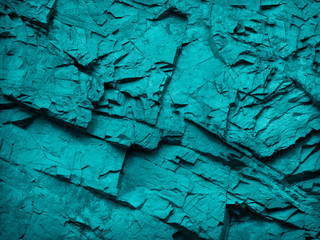 Blue green abstract background. Rock texture. Toned stone background. Close-up. A combination of...